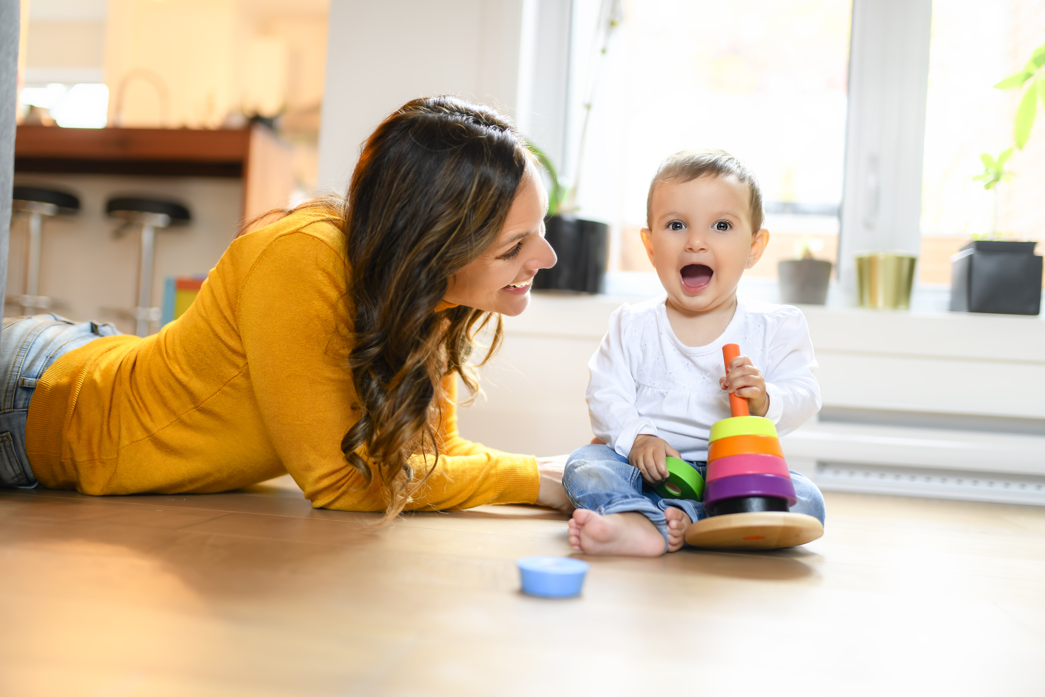 An Adorable Infant Baby Playing At Home Living Room play with her mother